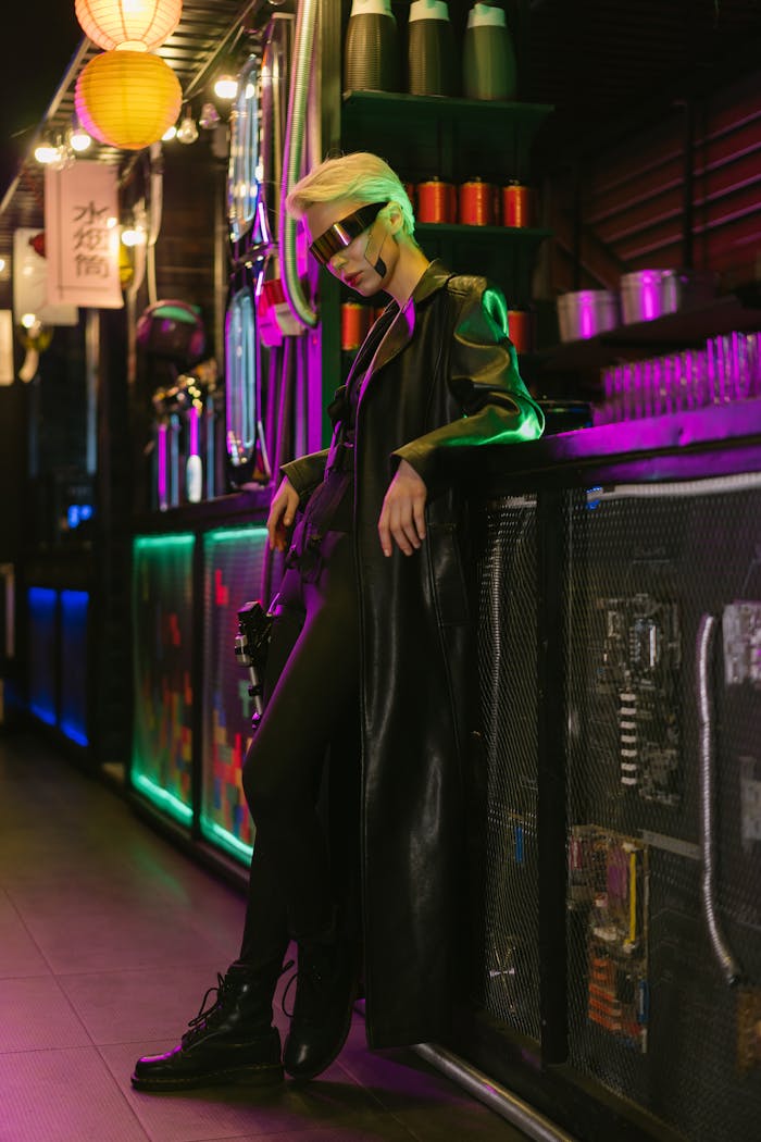 A woman in futuristic attire with visor eyewear stands in a neon-lit cyberpunk bar.